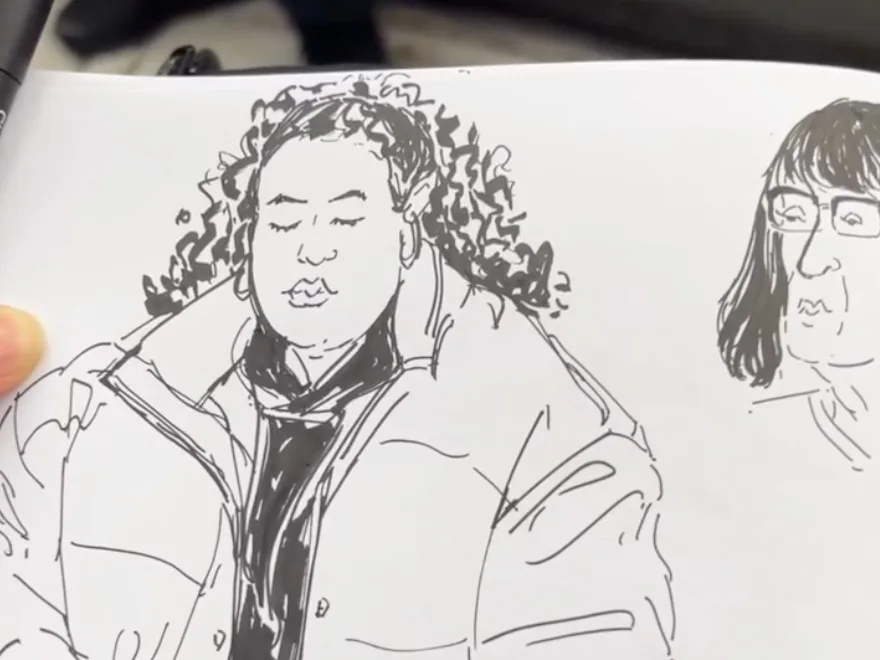 Brush-pen sketch of two passengers side by side: a woman with a full head of tight curls in a quilted jacket holding a phone, and beside her a smaller head with a straight bob and glasses.